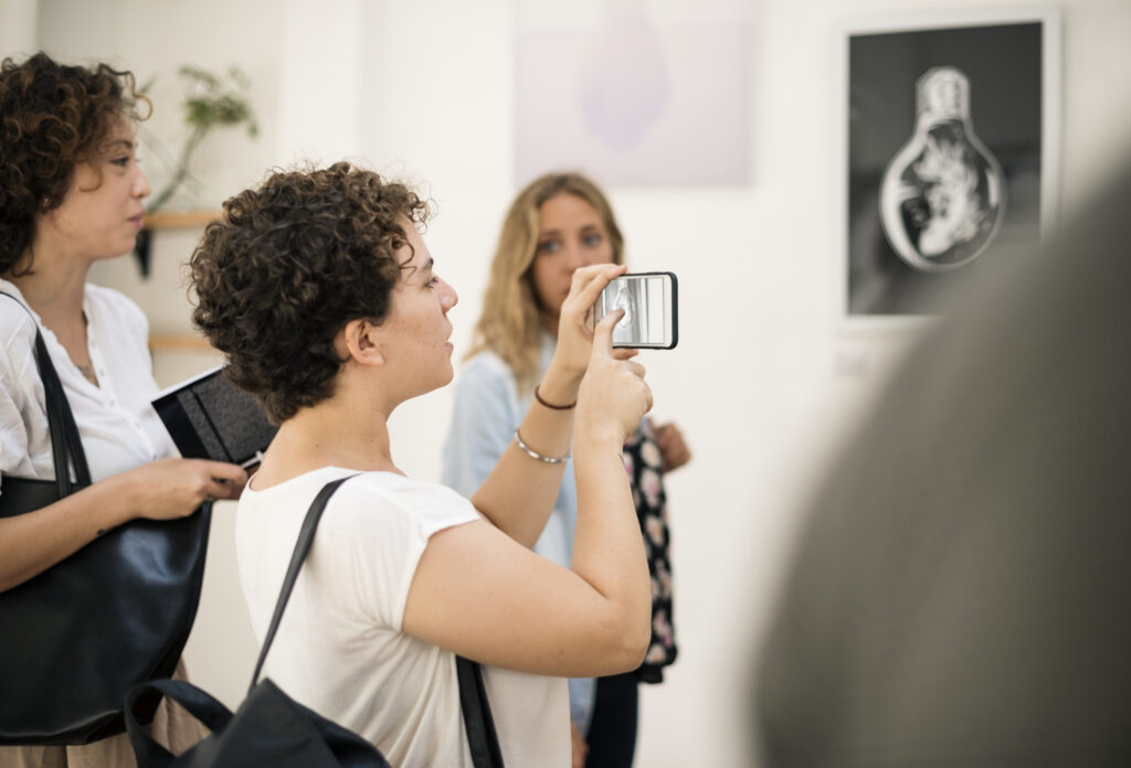 People attending an art exhibition